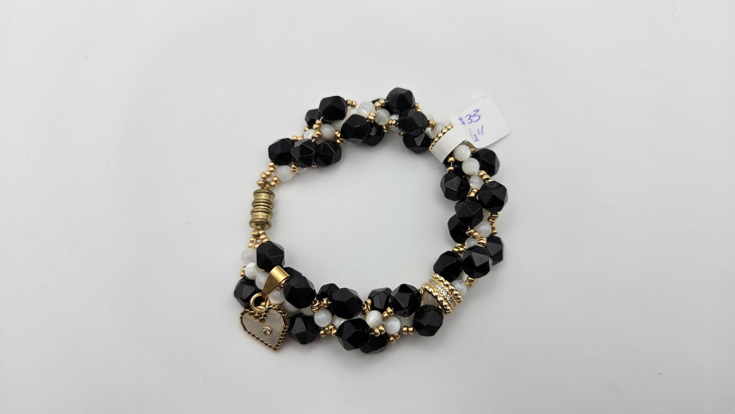 Black and white magnetic clasp bracelet for women size 6. Handmade with natural materials and gold accents. Heart charm. Obsidian and Shell