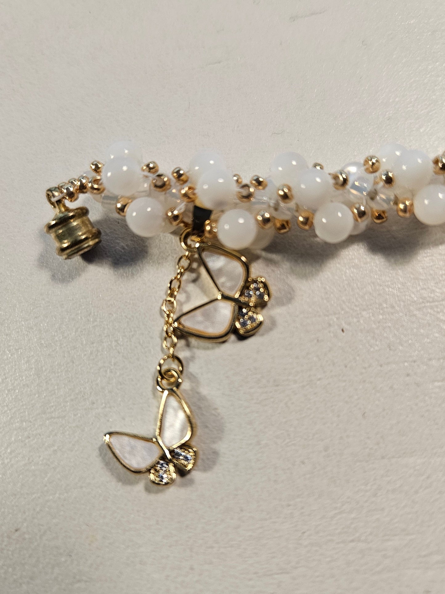 White shell woven spiral bracet- gold accents-magnetic clasp - 7 inch - butterfly charm - beautiful gift