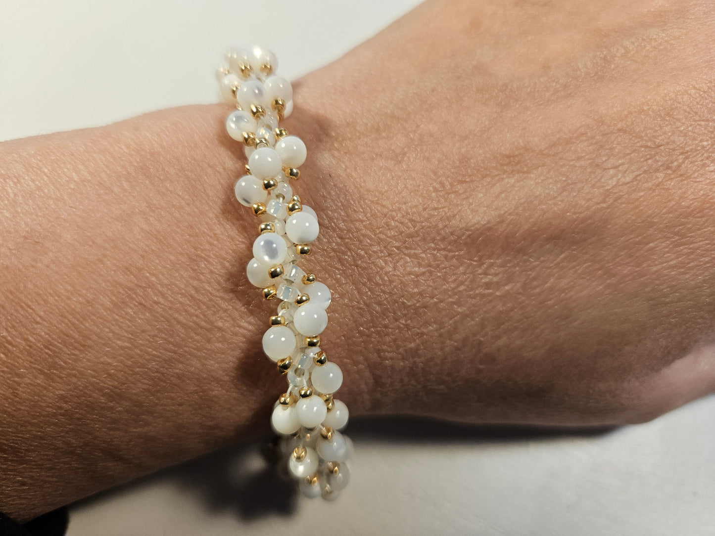 White shell woven spiral bracet- gold accents-magnetic clasp - 7 inch - butterfly charm - beautiful gift