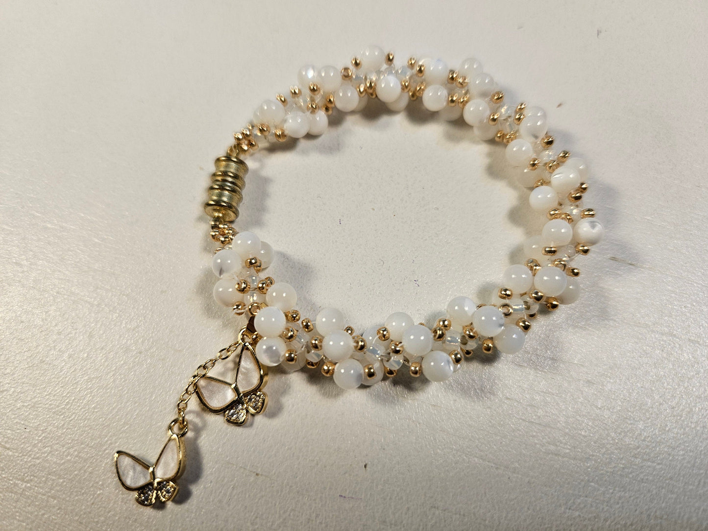 White shell woven spiral bracet- gold accents-magnetic clasp - 7 inch - butterfly charm - beautiful gift