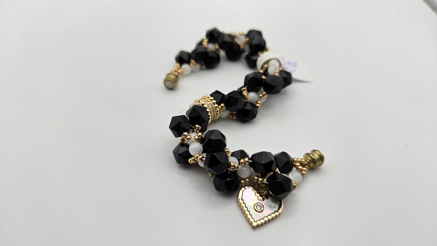 Black and white magnetic clasp bracelet for women size 6. Handmade with natural materials and gold accents. Heart charm. Obsidian and Shell