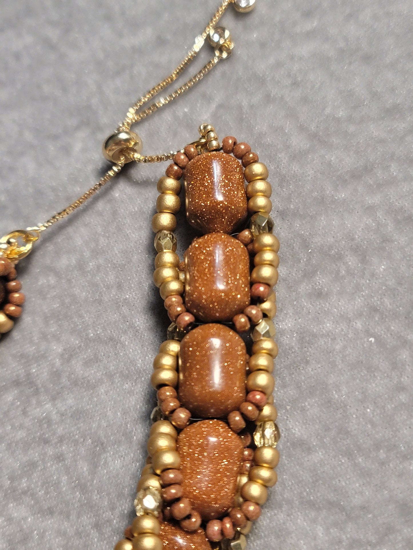 Chunky gold sandstone bracelet bead weaving with adjustable closure.