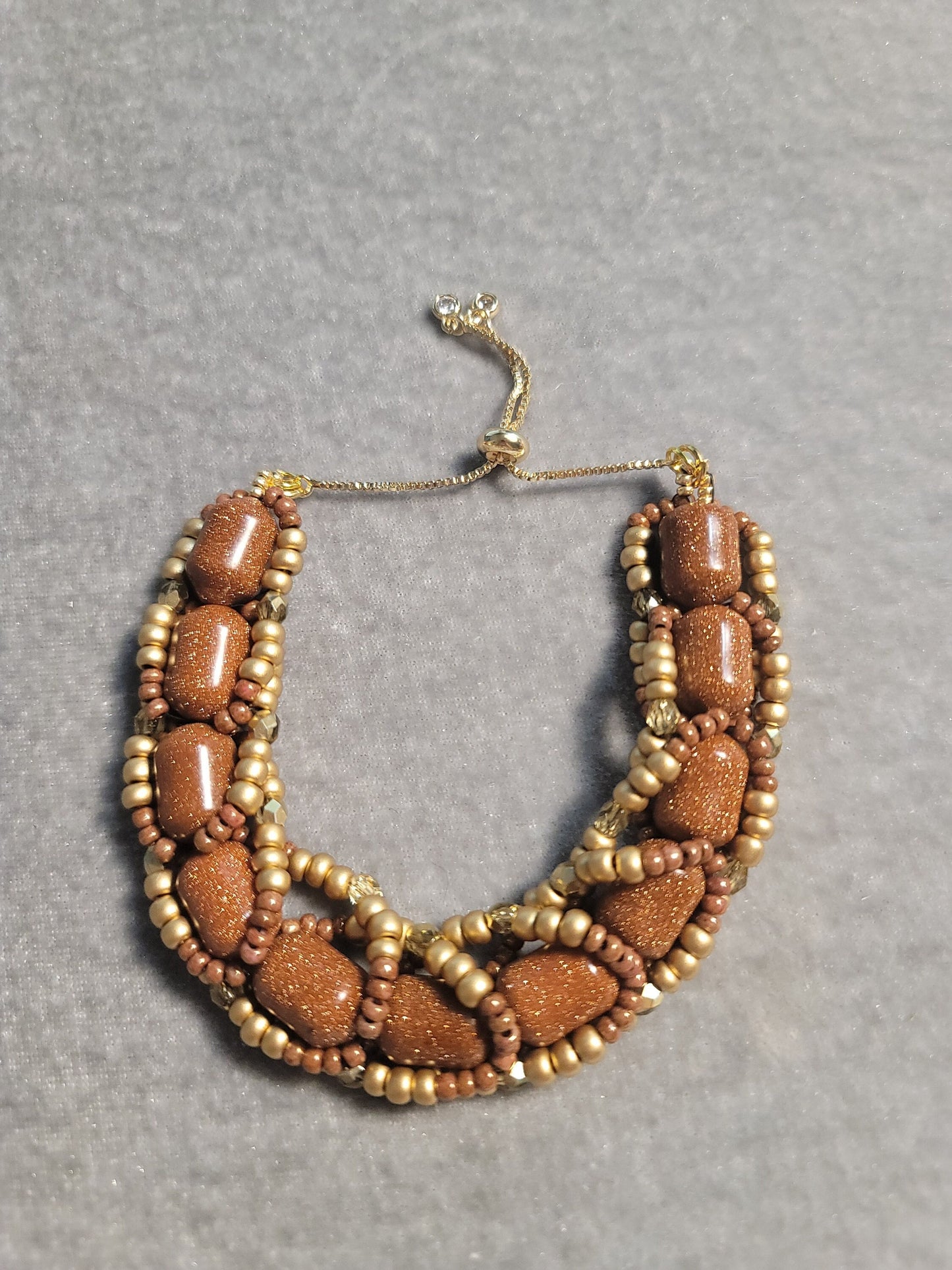 Chunky gold sandstone bracelet bead weaving with adjustable closure.